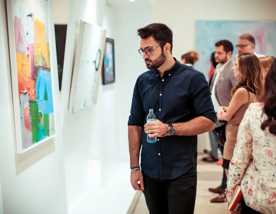 Spectators at the Bridges Exhibition at the KAICIID Dialogue Centre. Photo: David Pan. 